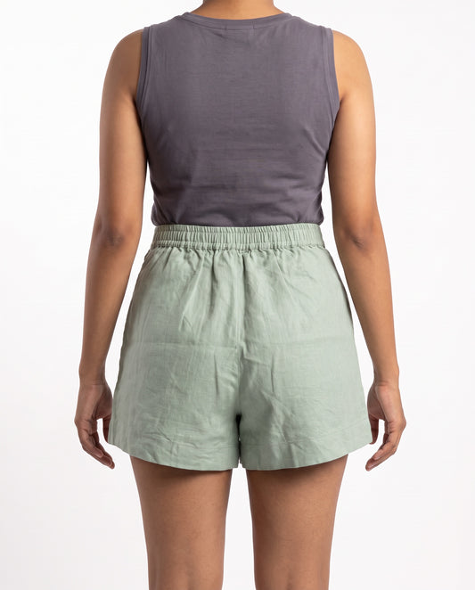 Sage linen skort with pockets, back view with elastic waist