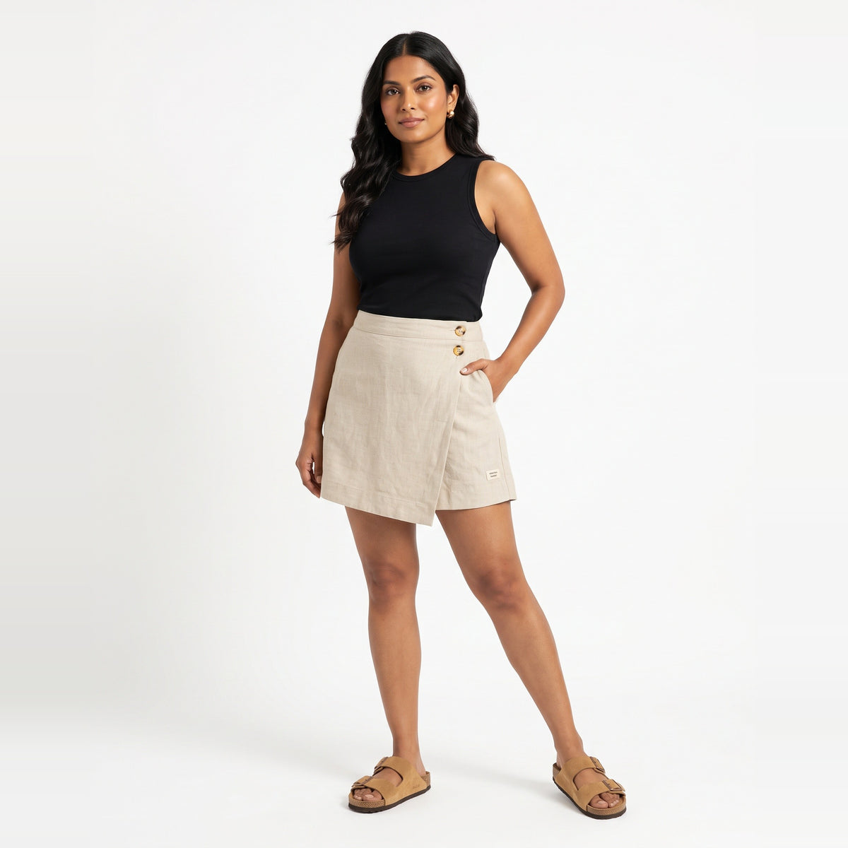 Beige linen skort with pockets, front view on model