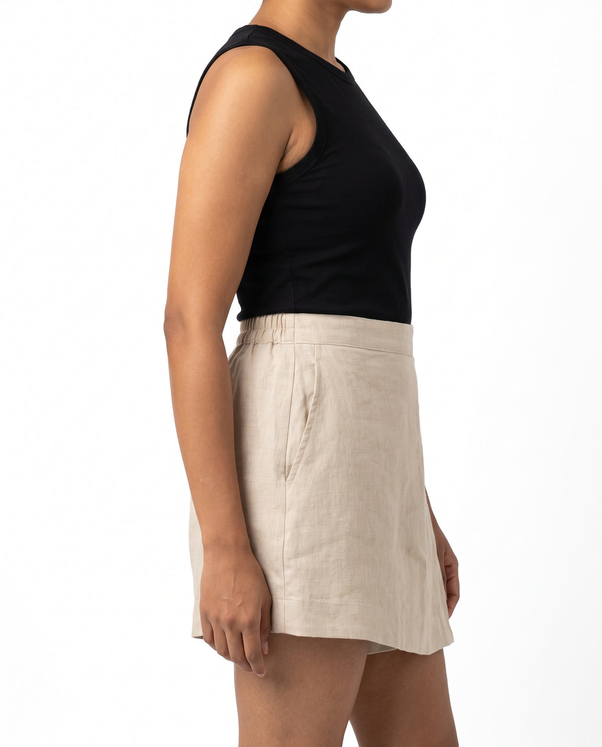 Beige linen skort with pockets, left side view