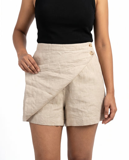 Beige linen skort with pockets, wrap flap lifted to show the shorts underneath