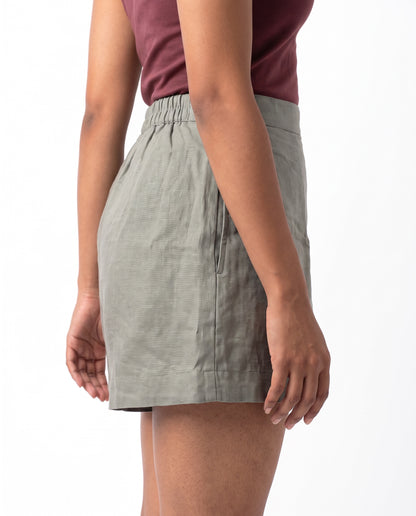 Grey linen skort with pockets, left side view