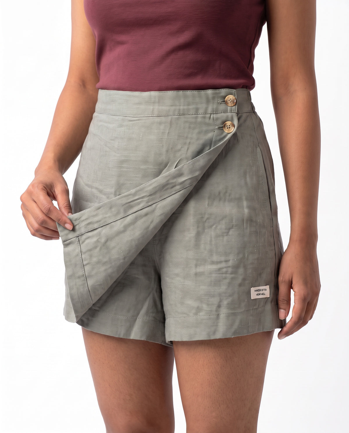 Grey linen skort with pockets, wrap flap lifted to show the shorts underneath