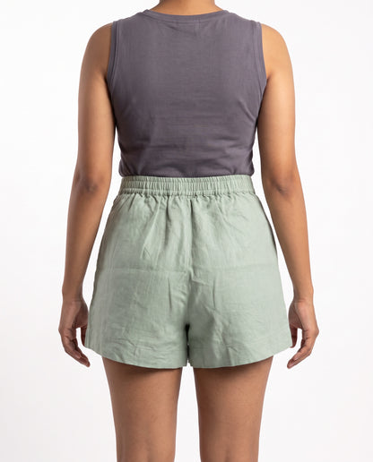 Sage linen skort with pockets, back view with elastic waist