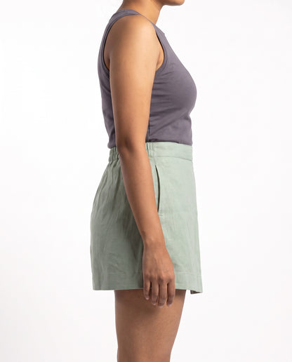 Sage linen skort with pockets, left side view