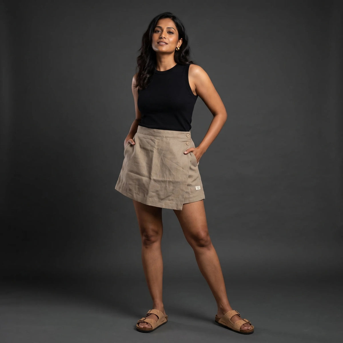 Taupe linen skort with pockets, front view on model