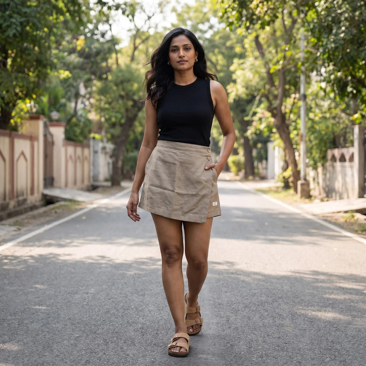 Taupe linen skort with pockets, worn outdoors